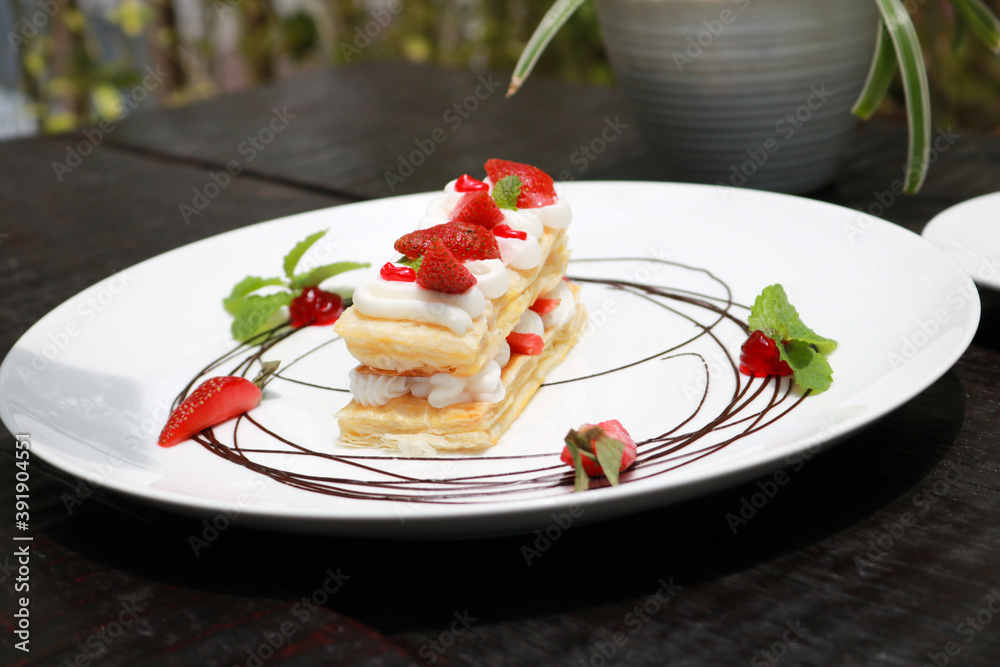 Strawberry Mille Feuille cake in white plate Strawberry Mille Feuille cake in white plate