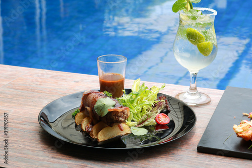 delicious food and drink with pool view