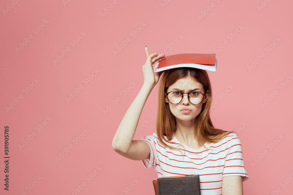 beautiful female student holding books education institute gesturing with hands pink background Copy Space