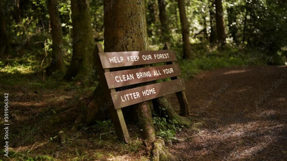 Anti-littering Sign in the middle of a Forest Anti-littering Sign in the middle of a Forest