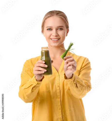 Young woman with wheatgrass...