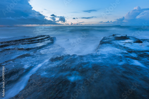 Closeup of rocks on the coast at sunrise, beautiful coastal landscape