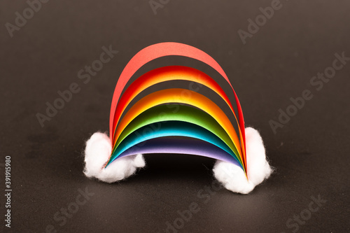 Handmade Kids Rainbow with Clouds made of Paper and whool on Black Background