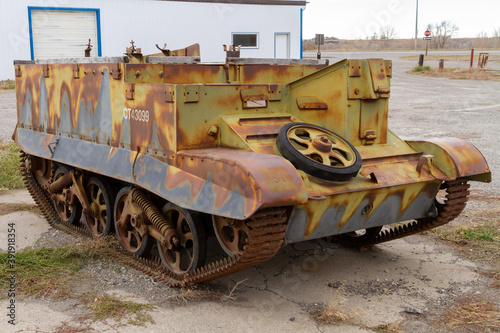 Vintage and rusted World War Two era armoured car sits neglected in southern Alberta. photo