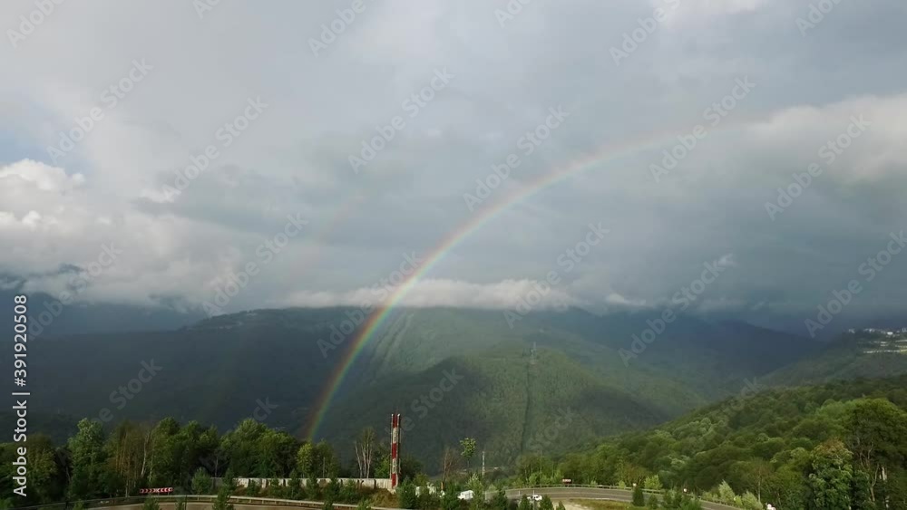 Rainbow in the mountains. A view of the sprawling rare double rainbow in the mountainous terrain. Travel in Russia, Sochi. Stunning nature. High quality FullHD footage Rainbow in the mountains. A view of the sprawling rare double rainbow in the mountainous terrain. Travel in Russia, Sochi. Stunning nature. High quality FullHD footage