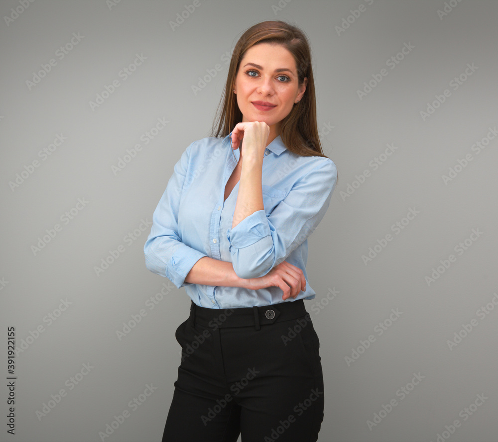 Smiling woman in blue shirt touches her chin. Smiling woman in blue shirt touches her chin.