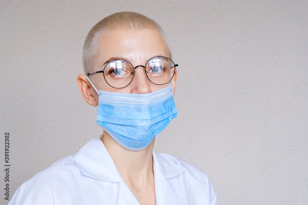 Doctor in a medical mask and protective suit against coronavirus infection. Doctor in a medical mask and protective suit against coronavirus infection.