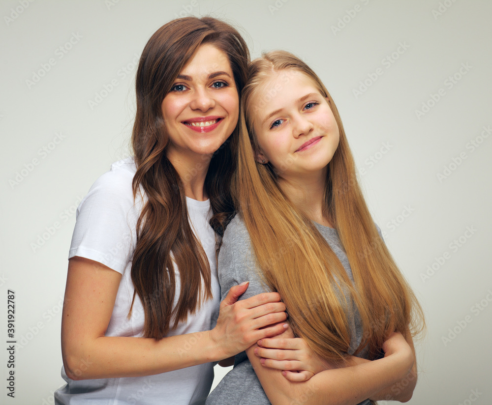 young woman and smiling teenager young woman and smiling teenager