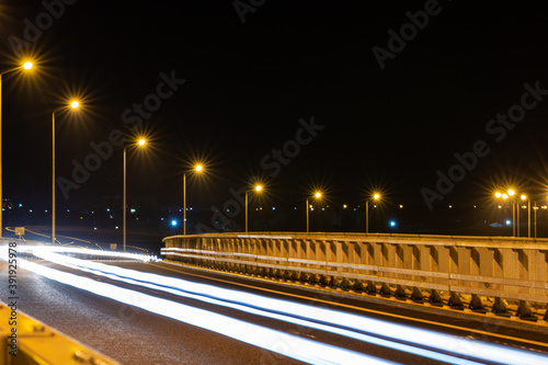 Long exposure photo of traffic on the move at night on the road