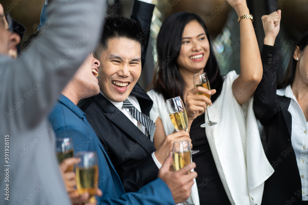 Group Of Asian Friends Enjoying Evening Drinks in bar. Celebration, Party People Christmas and Happy new year concept. Asian business people in party. Group Of Asian Friends Enjoying Evening Drinks in bar. Celebration, Party People Christmas and Happy new year concept. Asian business people in party.