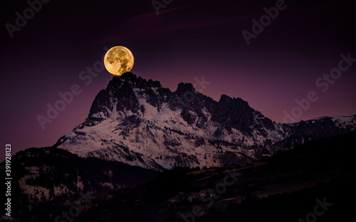 Red full moon setting on the Chabrieres' needles - Coucher de Lune sur les Aiguilles de Chabrières, Reallon, Hautes Alpes, France photo
