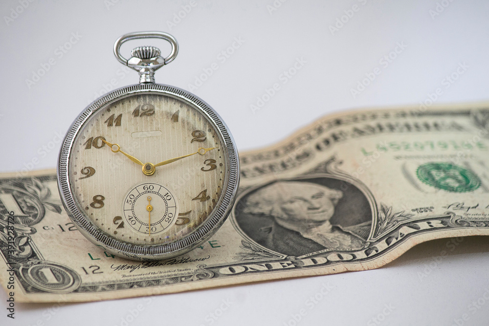 Pocket watch and 1 dollar banknote Pocket watch and 1 dollar banknote
