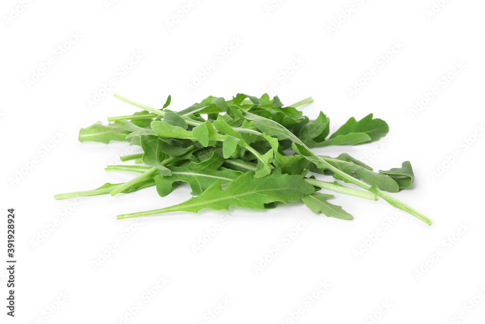 Heap of fresh arugula leaves isolated on white Heap of fresh arugula leaves isolated on white