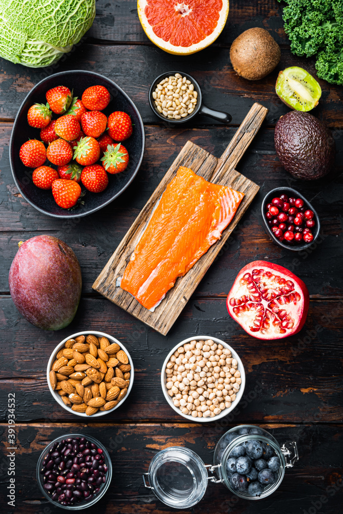 Healthy food and diet concept, top view on dark wooden background