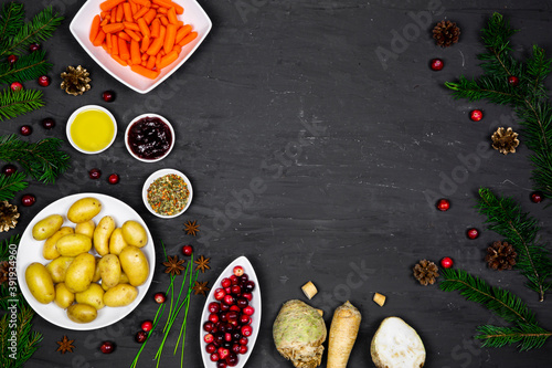 Christmas dinner preparation, fresh root vegetables on fesitive background, copy space. photo