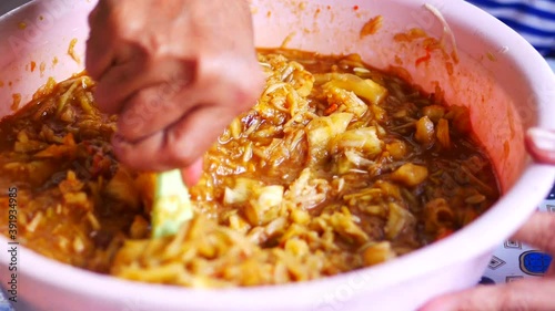 Taking rujak serut.  Rujak serut is fruits are shaved and seasoned with chilies, brown sugar, tamarind and salt. It tastes spicy, sweet and fresh.  photo