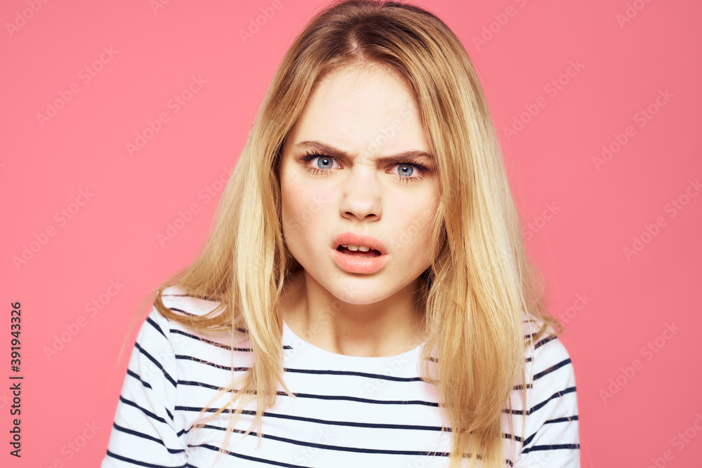 Blonde striped t-shirt emotion gesture hands displeased facial expression pink background Blonde striped t-shirt emotion gesture hands displeased facial expression pink background