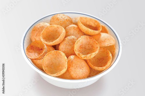 Crispy and crunchy Salty wheat cup & Katori, vatka, moon chips, vatki, fryums or frymus, snack food, Indian Pouch Packing Street Food, selective focus - Image photo