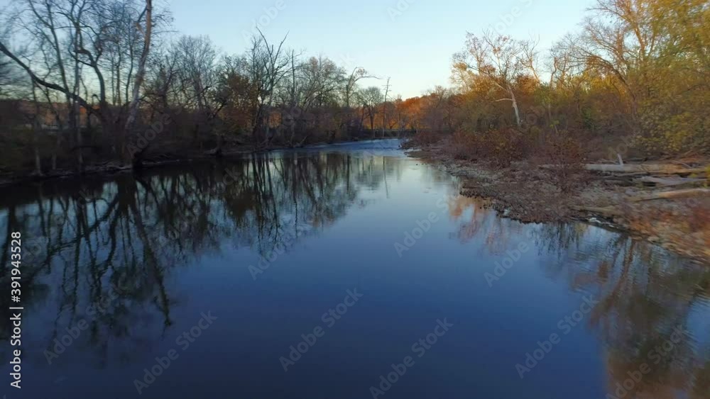 Fast moving aerial shot flying over Elkhorn Creek at sunset in the fall Fast moving aerial shot flying over Elkhorn Creek at sunset in the fall
