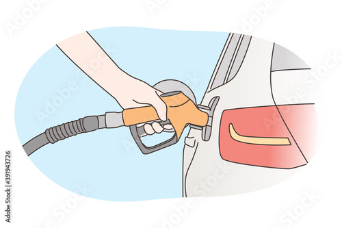 Economy, filling, petrol concept. Human hand refueling car on fuel station or pumping petroleum gasoline oil. Service fulfilling gas biodiesel into vehicle tank. Automotive industry transportation.