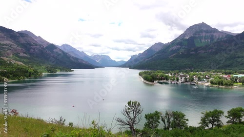 Beautiful Lake Waterton, with a view of the town of Waterton. The world's first International Peace Park shared by Canada and the United States of America. In the distance is Glacier National Park. photo