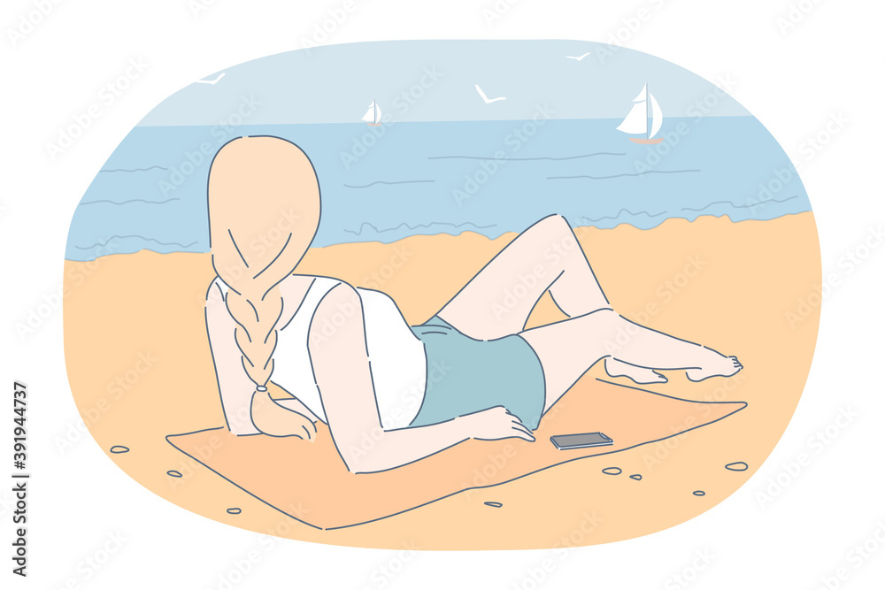 Fototapeta premium Summer, vacation, relax concept. Woman girl lying on beach ocean coast enjoying seaside recreation solitude watching seascape with sailboats seagulls. Holiday rest and summertime sunbathing on sand. 