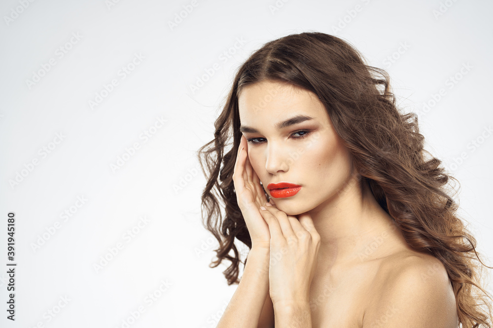 Naklejka premium Beautiful woman with drawn swords bright makeup glamor close-up light background