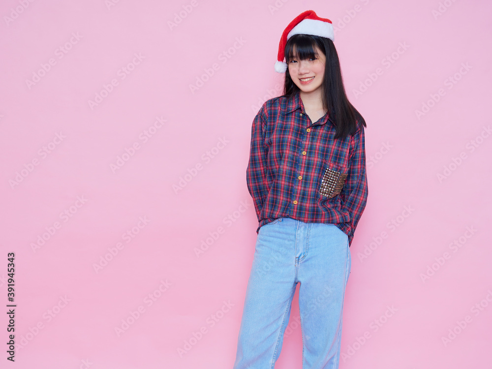 teenage girl wearing santa hat