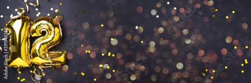 фотографія Gold foil balloon number, digit twelve