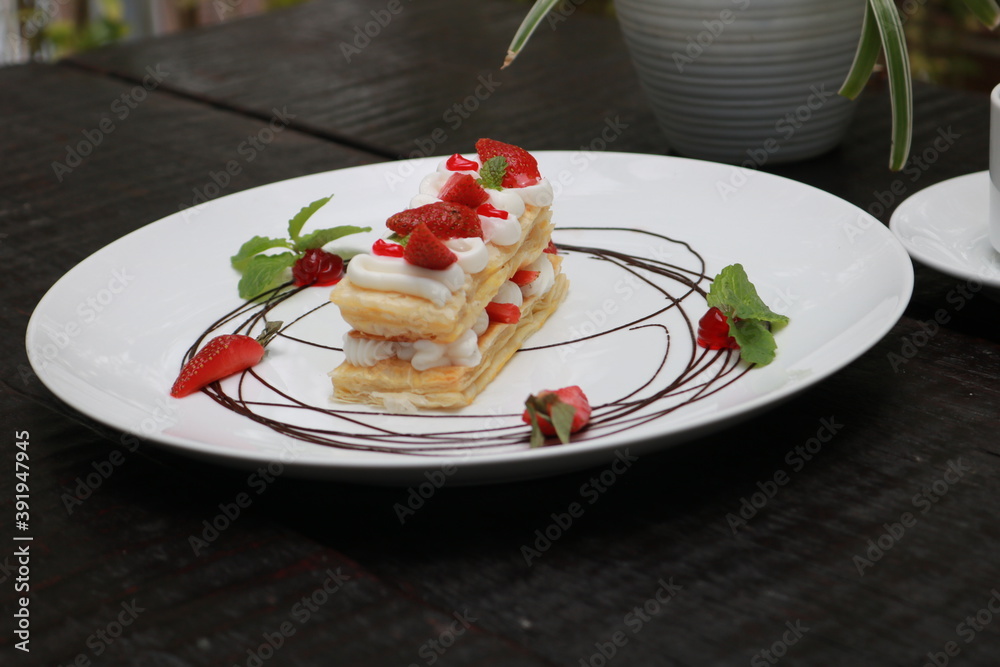 Strawberry Mille Feuille cake in white plate. Strawberry Mille Feuille cake in white plate.