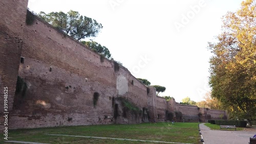 Aurelian Walls located in Rome close to viale metronio. The city walls of the capital of Italy have been built between 271 AD and 275 AD. Pan motion. photo