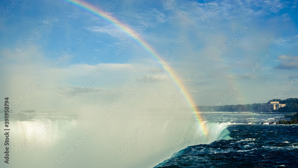 Rainbow over Niagara Falls during summer, Canada Rainbow over Niagara Falls during summer, Canada