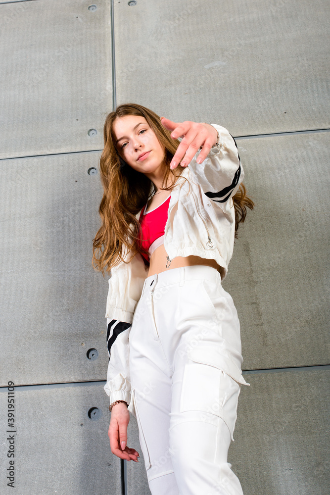 Teenage female dancing hip-hop in studio, casual clothes Teenage female dancing hip-hop in studio, casual clothes