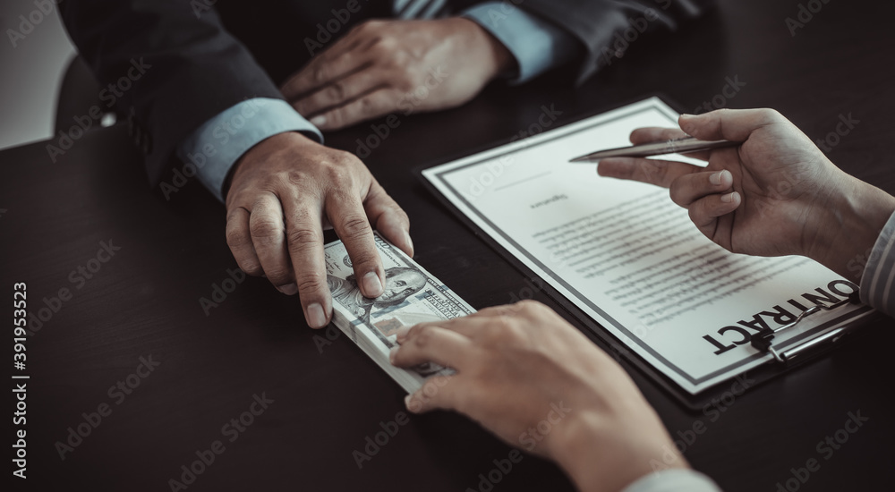 Fototapeta premium Business people take bribes or financial fraud money.