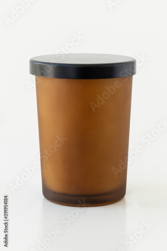Brown candle vessel with black lid