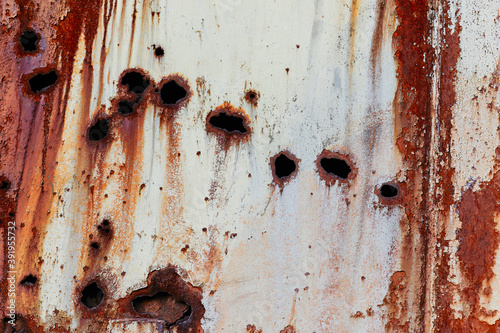 Grunge metal texture with rust and bullet holes. Abstract vintage background for photoshop