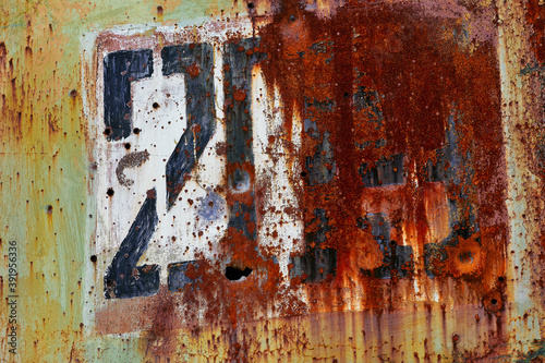 Rusty figure 203 on the door of the military hangar. Metal texture with numbers. Metal with numbers for 3D games.