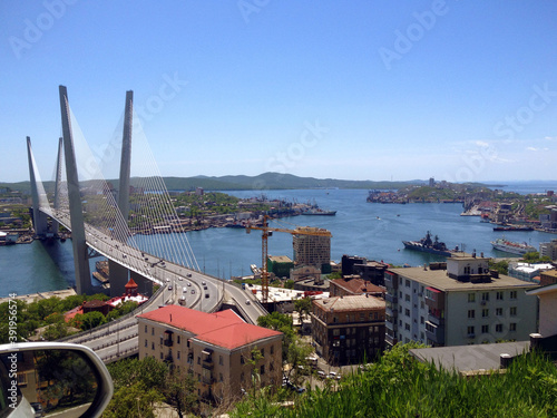 View of the Golden Bridge built across the Golden Horn Bay. Photo taken from the car. Vladivostok, Primorsky Krai, Russia.