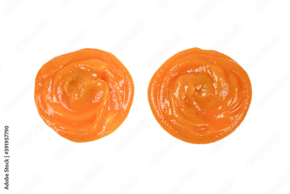 Orange sauce splashes isolated on white background Orange sauce splashes isolated on white background