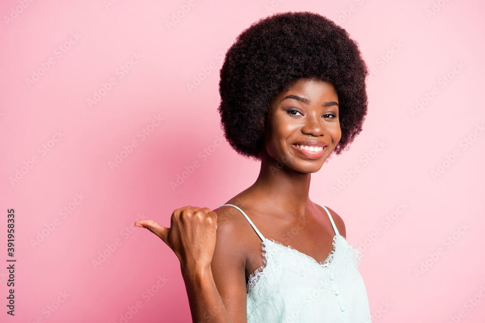 Close up portrait of pretty person indicate thumb empty space proposition blue singlet isolated on pink color background