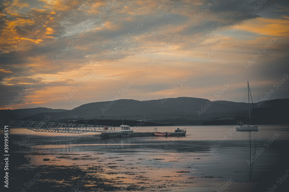 picturesque view on sea coastline and cloudy sunset sky	