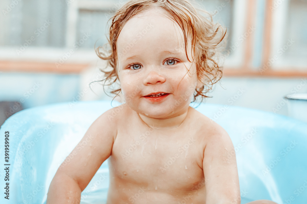 a little boy is bathing in a bath Stock Photo Adobe Stock