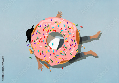 Large sprinkle donut crushing woman
