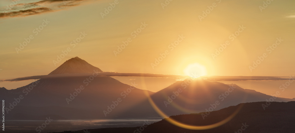 Kamchatka, sunlight over the summit of Avachinsky volcano