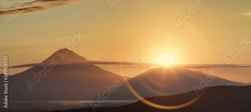 Kamchatka, sunlight over the summit of Avachinsky volcano