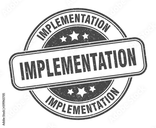 implementation stamp. implementation label. round grunge sign
