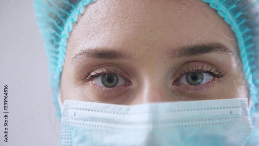 Doctor woman wearing medical mask close up Doctor woman wearing medical mask close up