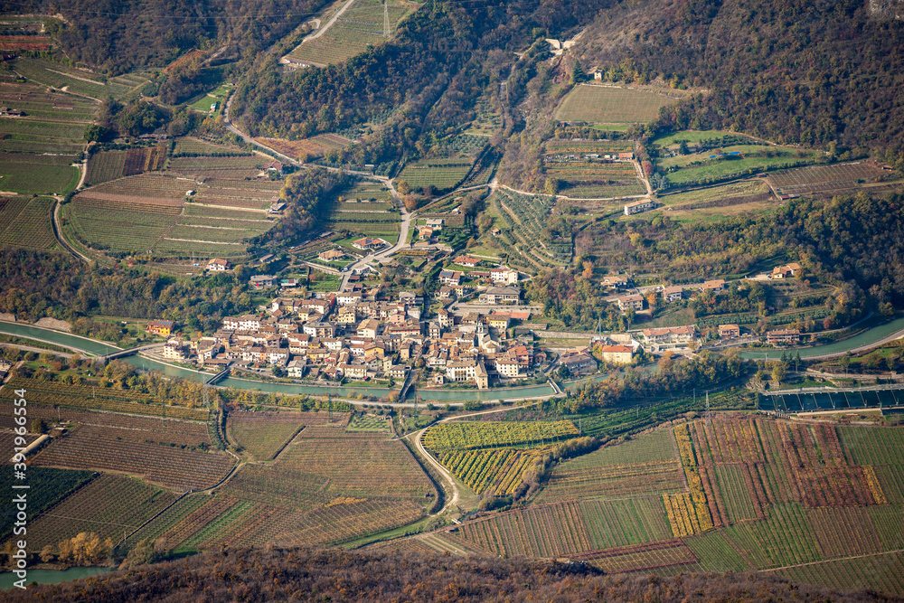 Aerial view of Adige Valley, Vallagarina, from the Mountain peak of Corno d'Aquilio with the small village of Brentino Belluno or Belluno Veronese, Veneto, Italy, Europe.