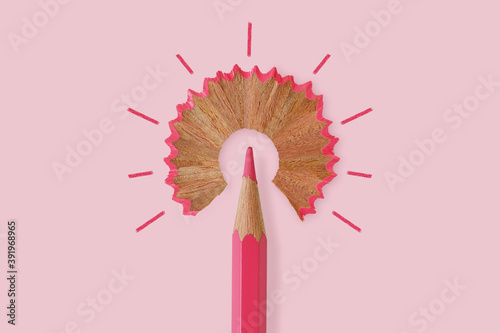 Pink pencil like a light bulb on pink background - Concept of women and creative thinking