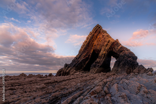 Blackchurch Rock, Devon seen at sunset at low tide